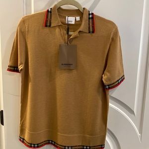 Brand new Burberry shirt sleeve sweater. Tan with plaid collar and sleeve trim.